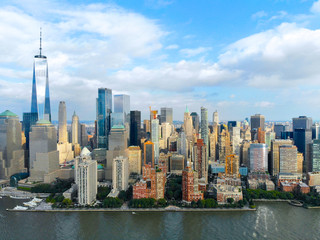 Fototapeta na wymiar Stunning aerial view of Manhattan Skyline, with World Trade Center, New York, USA. Panoramic skyline with skyscrapers and financial district and Hudson river, New York, USA