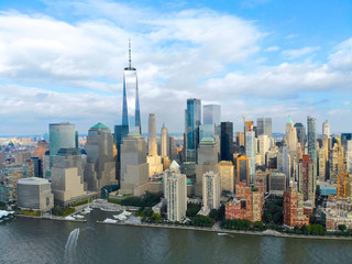 Stunning aerial view of Manhattan Skyline, with World Trade Center, New York, USA. Panoramic skyline with skyscrapers and financial district and Hudson river, New York, USA