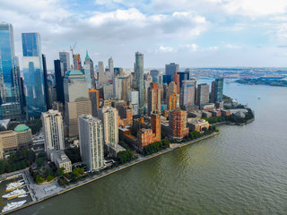 Obraz premium Stunning aerial view of Manhattan Skyline, with World Trade Center, New York, USA. Panoramic skyline with skyscrapers and financial district and Hudson river, New York, USA
