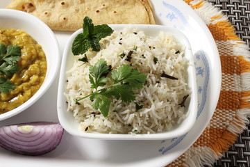traditional Indian gujarati food dish basmati jeera rice with dal fry fried with cumin seeds