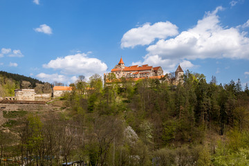 Pernstejn Castle stands in the woods on a high rock