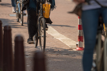 Fototapeta na wymiar People riding bicycle in city