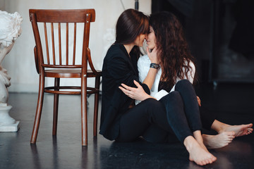 Obraz premium Two girls in each other's tender embraces