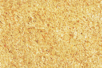 Seamless texture of a rough concrete wall of light orange-yellow color.
