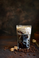 Homemade delicious iced coffee in a tall glass.