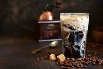 Homemade delicious iced coffee in a tall glass.
