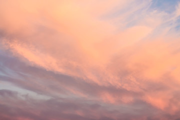 Fototapeta premium Sunset pink sky. Bright orange sky at sunrise. Beautiful gentle pinworm clouds.