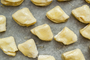 Cottage cheese cookies are on a baking sheet before cooking in the oven
