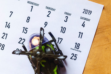 Calendar with toy helicopter as symbol of national armed forces day. 18 May 2019 - Armed Forces Day