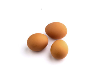 3 chicken eggs isolated on white background with shadows