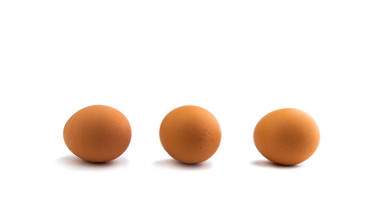 3 chicken eggs isolated on white background with shadows