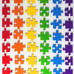 pride of sexual minorities concept: LGBT rainbow flag of individual colored puzzle on a white background, short focus, effect paint