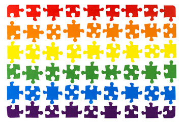 Naklejka premium LGBT concept: gay flag of separate multi-colored puzzle on white