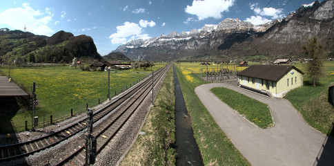 Fototapeta na wymiar View along railway lines to the Churfirsten seen from Flums