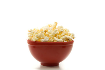 Close Front View of Buttered Popcorn in a Red Bowl Isolated on White