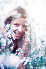 A woman enjoying the white flowers 