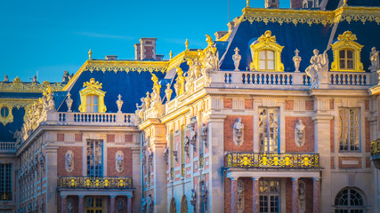 Famous palace Versailles with beautiful gardens outdoors near Paris, France. The Palace Versailles...
