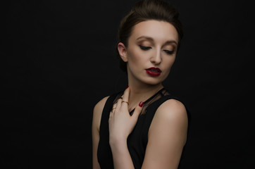 beautiful girl with jewelry on black background