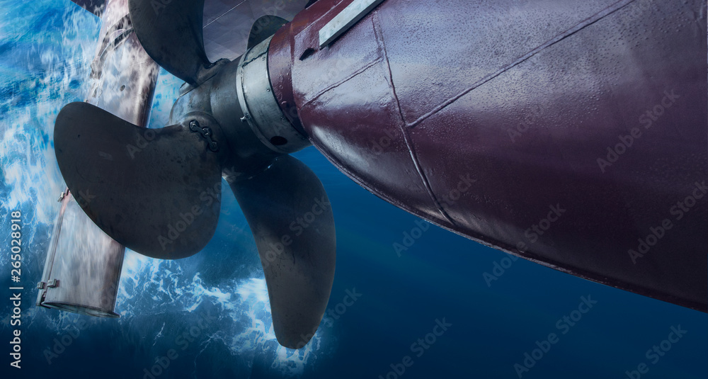 Wall mural propeller and rudder of big ship underway view from underwater. close up image detail of ship.