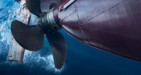 Propeller and rudder of big ship underway view from underwater. Close up image detail of ship. - obrazy, fototapety, plakaty