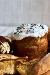 Traditional Russian Easter cakes kulich, with colored eggs, close-up