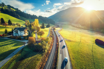 Aerial view of the road in mountain valley at sunset in spring in Dolomites, Italy. Top view of...