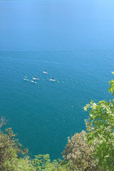 Fototapeta na wymiar SUP - Stand Up Paddle in Garda lake