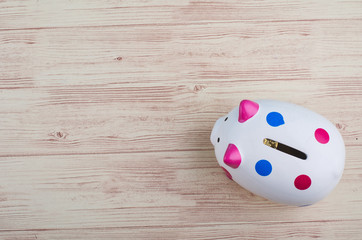 financial crisis concept, empty piggy bank over wooden background