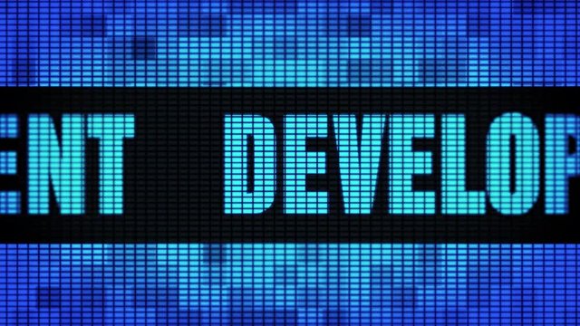Development Front Text Scrolling on Light Blue Digital LED Display Board Pixel Light Screen Looped Animation 4K Background. Sign Board , Blinking Light, Pixel Monitor, LED Wall Pannel