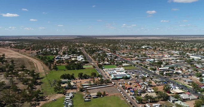 Lightning ridge small regional remote town - centre of opal mining industry in Australia. Aerial elevated view over flat plains and town streets.