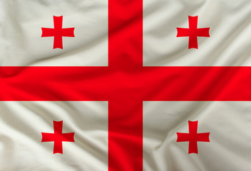 The color flag of Georgia is depicted on silk fabric with soft folds