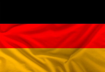 Obraz premium color German national flag on draped textile, background
