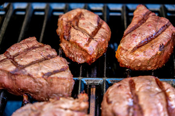 Filet Mignon cooking on bbq grill