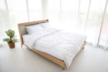 new modern white bed in bedroom with soft and clear light
