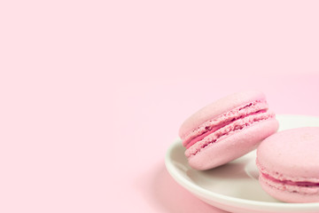 French pink macaroons on pink background