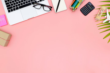 Flat lay office workspace with blank laptop, clipboard, top view laptop background and copy space on pink background, Above view shot of laptop background, Laptop background