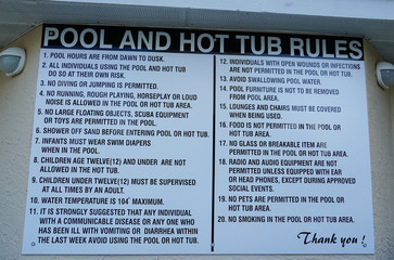 Sign at a resort or homes association pool stating the rules for use of pool and hot tub.