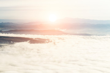 Fototapeta premium Sun rise At high mountains.White mist.morning