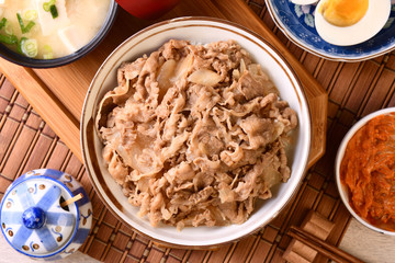 Gyudon - a bowl of rice with sliced beef, onion and sweet sauce. 