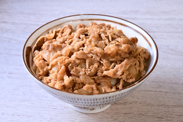 Gyudon - a bowl of rice with sliced beef, onion and sweet sauce. 