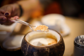 Patches made from coconut milk are packed in fresh coconut shells