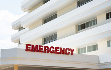 Modern public hospital white building , Emergency Room Entrance . - 265050121