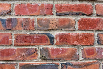New brick wall, new texture of red stone blocks closeup