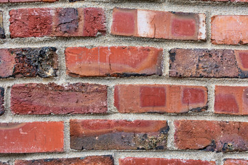New brick wall, new texture of red stone blocks closeup