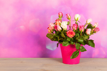 Fototapeta na wymiar Bouquet colorful roses in vase