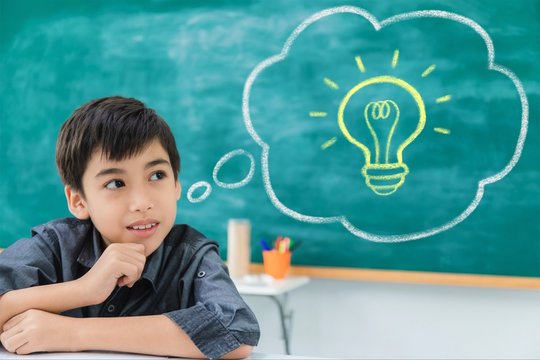 Asian Happy School Boy Dreaming And Thinking With Bubble Speech And Lighbulb Idea On Blackboard Background With Copy Space.Creative Education Of Kid Student Concept.