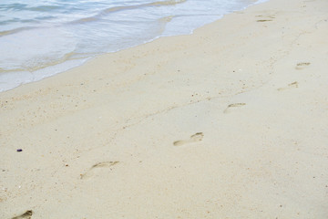 Texture footprints in the sand on the beach. Relax time concept, travel concept