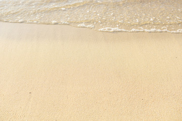 Fototapeta na wymiar Sand beach and ocean wave with copy space. Summer concept