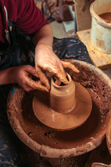 Potter at work. Workshop place.