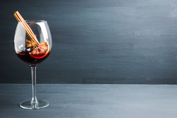 Red wine in glass on the rustic background. Selective focus. Shallow depth of field.